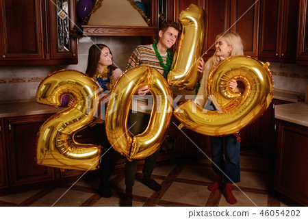 New 2019 Year is coming. Group of cheerful New 2019 Year is coming. Group of cheerful 46054202