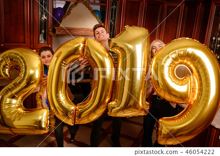 New 2019 Year is coming. Group of cheerful New 2019 Year is coming. Group of cheerful 46054222