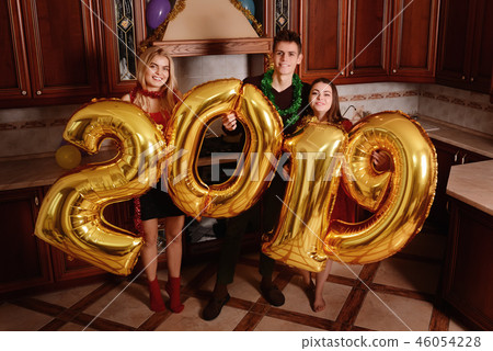 New 2019 Year is coming. Group of cheerful New 2019 Year is coming. Group of cheerful 46054228