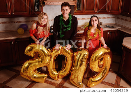 New 2019 Year is coming. Group of cheerful New 2019 Year is coming. Group of cheerful 46054229