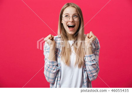 Close up studio photo portrait of attractive woman with open mouth making crazy astonished emotion Close up studio photo portrait of attractive woman with open mouth making crazy astonished emotion 46055435