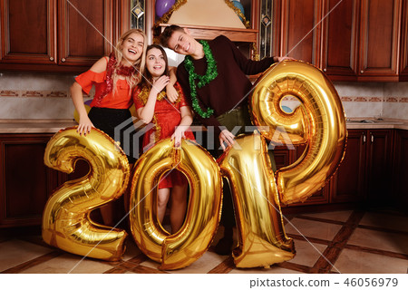 New 2019 Year is coming. Group of cheerful New 2019 Year is coming. Group of cheerful 46056979