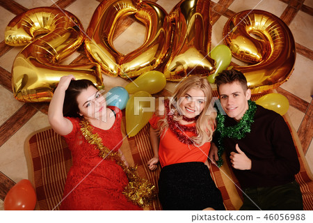 New 2019 Year is coming. Group of cheerful New 2019 Year is coming. Group of cheerful 46056988