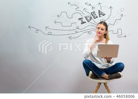 Brainstorming idea arrows with young woman using her laptop Brainstorming idea arrows with young woman using her laptop 46058006