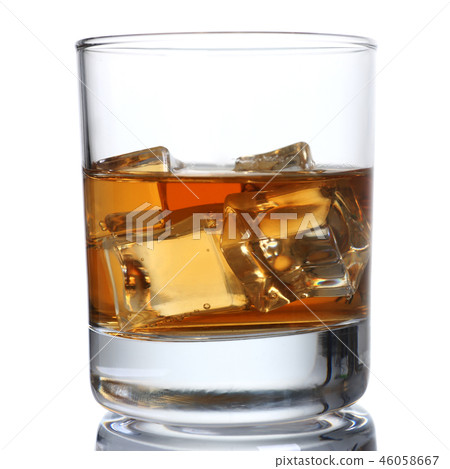 Whiskey with ice in a glass isolated Whiskey with ice in a glass isolated 46058667