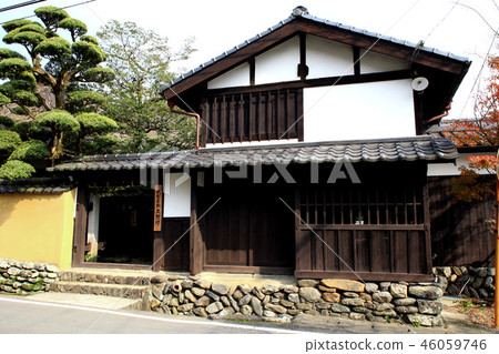 Autumn Fall Moon Landscape around the ruins of Akizuki Castle stained red in autumn leaves 46059746
