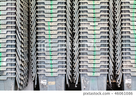 Plastic containers are stacked perfectly together 46061086