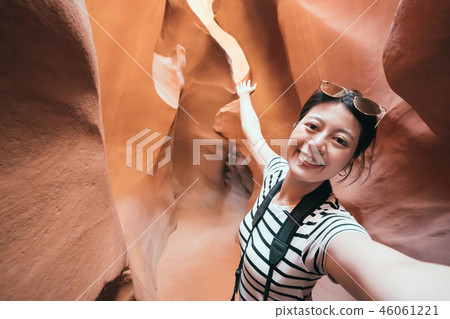 asian lady taking selfie showing the amazing view asian lady taking selfie showing the amazing view 46061221