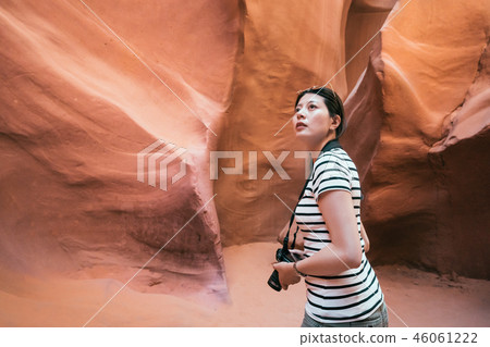 young lady traveler holding camera nature travel 46061222