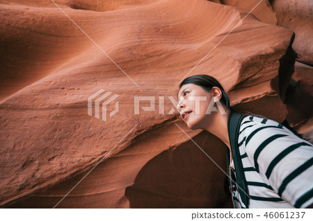 asian lady tourist curiously sightseeing asian lady tourist curiously sightseeing 46061237