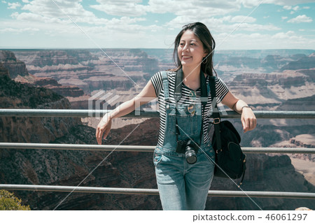 asian traveler relaxing on handrail hiking travel 46061297