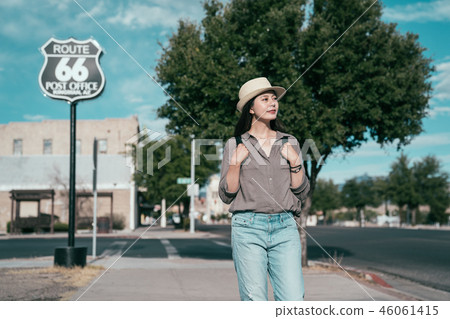 traveler standing in front of the famous sign traveler standing in front of the famous sign 46061415
