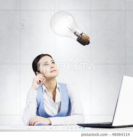 Pensive woman at work 46064114