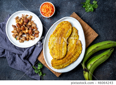 COLOMBIAN CARIBBEAN CENTRAL AMERICAN FOOD. Patacon or toston, fried and flattened whole green 46064243