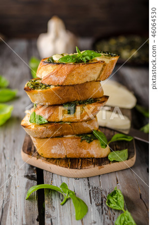 Garlic herbs toast with fresh mozzarella 46064530