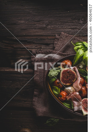Homemade fresh figs salad with herbs and roasted garlic toast Homemade fresh figs salad with herbs and roasted garlic toast 46064657
