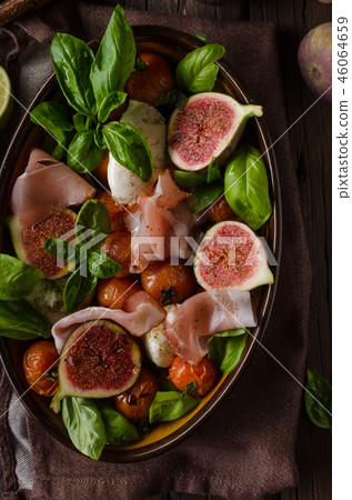 Homemade fresh figs salad with herbs and roasted garlic toast Homemade fresh figs salad with herbs and roasted garlic toast 46064659