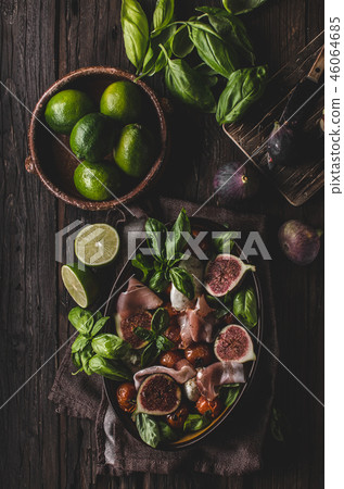 Homemade fresh figs salad with herbs and roasted garlic toast Homemade fresh figs salad with herbs and roasted garlic toast 46064685