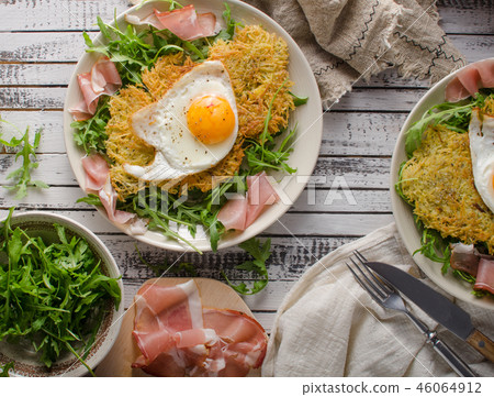 Potato pancakes with eggs and ham 46064912