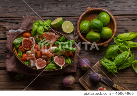 Homemade fresh figs salad with herbs and roasted garlic toast Homemade fresh figs salad with herbs and roasted garlic toast 46064966