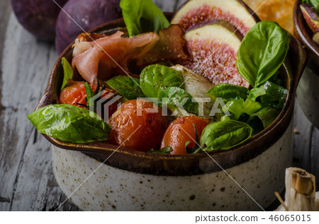 Homemade fresh figs salad with herbs and roasted garlic toast Homemade fresh figs salad with herbs and roasted garlic toast 46065015
