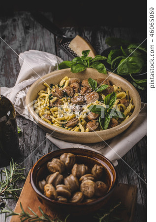 Homemade spaetzle, barbecue sausage and fresh cheese Homemade spaetzle, barbecue sausage and fresh cheese 46065069
