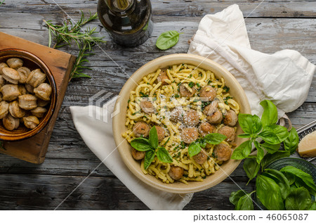 Homemade spaetzle, barbecue sausage and fresh cheese 46065087