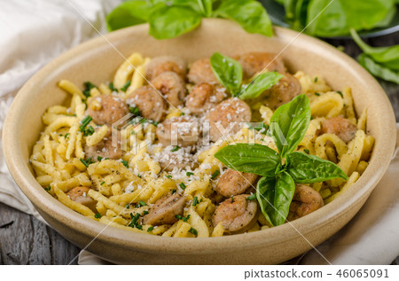 Homemade spaetzle, barbecue sausage and fresh cheese 46065091
