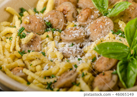 Homemade spaetzle, barbecue sausage and fresh cheese Homemade spaetzle, barbecue sausage and fresh cheese 46065149