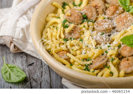 Homemade spaetzle, barbecue sausage and fresh cheese Homemade spaetzle, barbecue sausage and fresh cheese 46065154