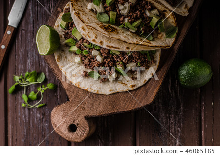 Homemade minced beef tortilla, fresh avocado and mozarella cheese Homemade minced beef tortilla, fresh avocado and mozarella cheese 46065185