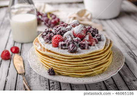Homemade crepes with frozen berries, topped sugar 46065186