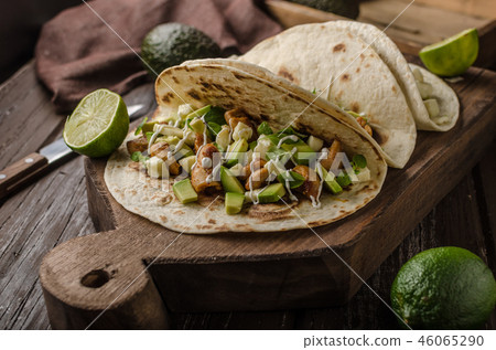 Homemade chicken thigh grilled, fresh avocado in tortilla Homemade chicken thigh grilled, fresh avocado in tortilla 46065290