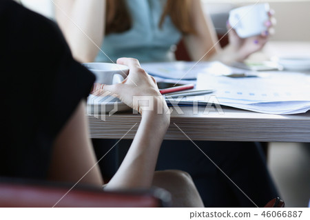 Woman blonde talking to friends in a cafe 46066887