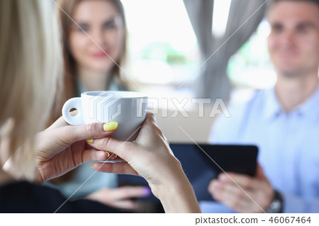 Woman blonde talking to friends in a cafe Woman blonde talking to friends in a cafe 46067464