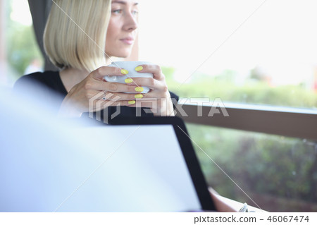 Businessman holding tablet in hand in cafe Businessman holding tablet in hand in cafe 46067474