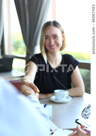 Smiling man and woman shake hands Smiling man and woman shake hands 46067483