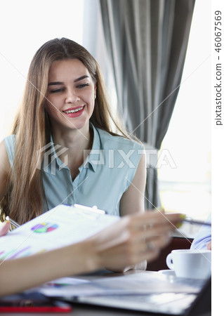 Two business women communicate in a cafe Two business women communicate in a cafe 46067569