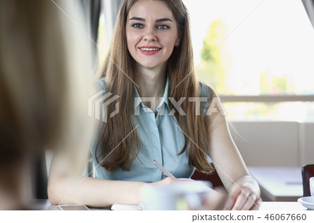 Beautiful smiling cheerful girl at workplace 46067660