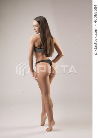 Pretty athletic brunette in rearview 46069684