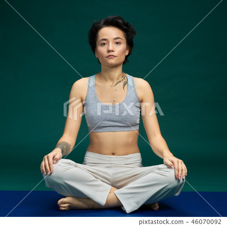 Pretty woman doing yoga exercise 46070092