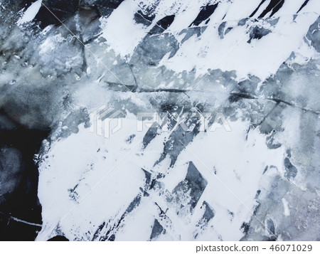 Broken ice on a frozen river. shards of ice. 46071029