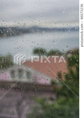 rain drops on window pane rain drops on window pane 46073236