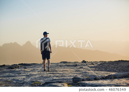 Tourist in mountain at sunset 46076349
