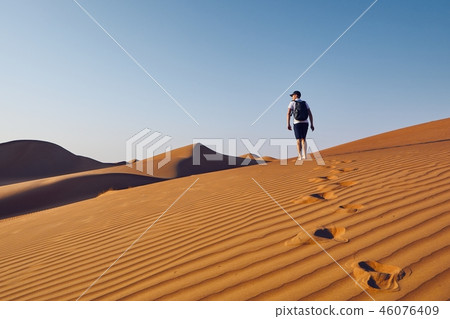 Tourist in desert Tourist in desert 46076409