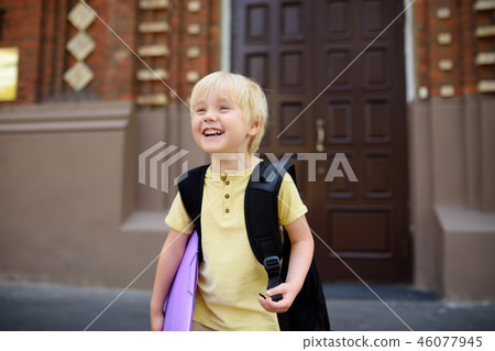 Student near the gate of the school building Student near the gate of the school building 46077945