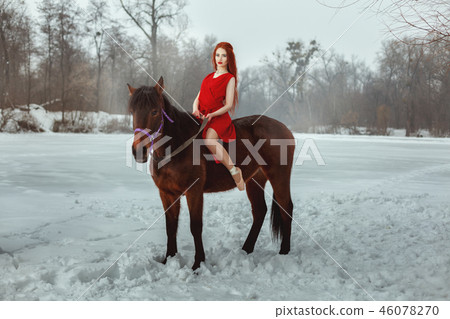 Beautiful woman sitting on horseback Beautiful woman sitting on horseback 46078270