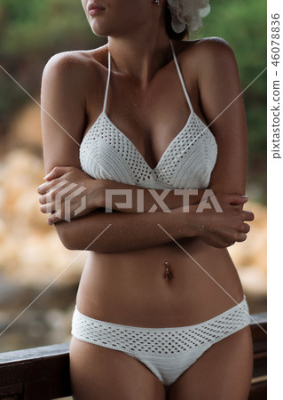 Woman in swimwear standing near sea 46078836