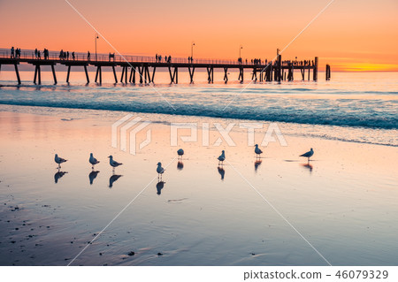 Iconic Glenelg Beach with jetty at sunset Iconic Glenelg Beach with jetty at sunset 46079329