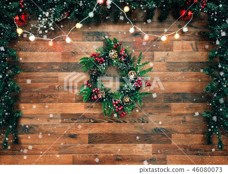 Christmas fir tree garland with christmas tree decoration on wooden board. Bright Christmas and New Christmas fir tree garland with christmas tree decoration on wooden board. Bright Christmas and New 46080073